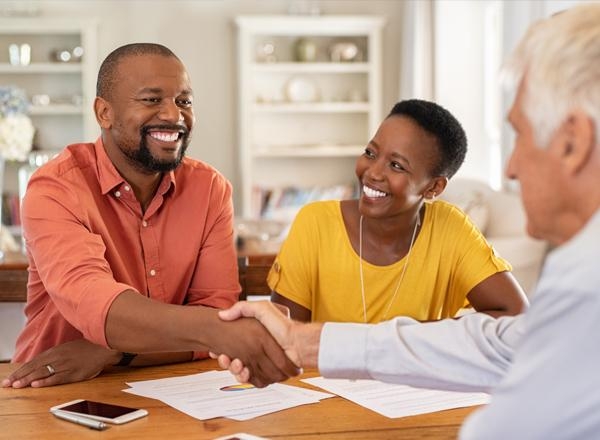 Couple signing contractor loan